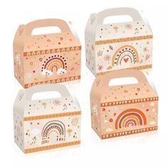 three boxes with rainbows and clouds painted on the sides, one has a handle