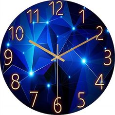 a blue clock with gold hands and numbers on the face is illuminated by bright lights