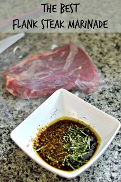 the best steak steak marinade in a white square bowl on a marble counter top