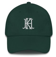 "Every two-letter combination is available, making this embroidered hat a truly custom piece. Details: - 100% chino cotton twill - Adjustable back strap with antique buckle - Fits a Head circumference of 20 ½\" - 21 ⅝\" WHEN ORDERING: 1. Please select the color of your hat (primary) and monogram (secondary) from the drop down menus. 2. List the two letters you would like combined. PLEASE NOTE: If you would like a proof of your monogram before it is printed, please leave request in the comments. Cotton Dad Hat With Letter Embroidery And Flat Bill, Cotton Fitted Hat With Embroidered Logo And Flat Bill, Custom Embroidered Cotton Dad Hat, Green Flat Bill Dad Hat With Embroidered Logo, Classic Cotton Fitted Hat With Embroidered Logo, Two Letter Monogram, Monogram Baseball Hat, Letter Combination, Couples Monogram