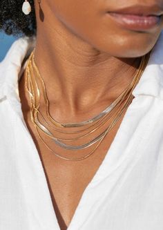 An unfailing new classic. This mini gold herringbone chain shimmers in any kind of light. Made from 18kt Gold Filled, this versatile chain is a striking statement worn alone or with a bevy of other beauties.✦ DETAILS ✦✧ Name: Laka - (Lah-kah) - Goddess of Hula.✧ Thickness: 1.5mm.✧ 18kt Gold Filled.✧ All Ke Aloha Jewelry pieces come packaged thoughtfully, beautifully, and ready for gift giving.✧ Unless otherwise noted in the listing description, all pieces are sold individually. Photos with model Heavy Chain Necklace, Gold Herringbone Chain, Sparkly Accessories, Gold Snake Chain, Mini Gold, Herringbone Chain, Herringbone Necklace, Heavy Chain, Heirlooms Jewelry