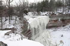 a frozen waterfall in the middle of winter