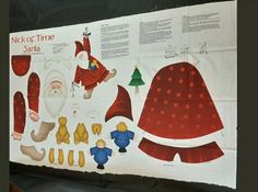 a paper cutout of santa claus and other christmas decorations on a sheet of paper