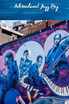 a mural on the side of a building with musical instruments painted on it's sides