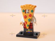 a lego figurine holding a slice of pizza