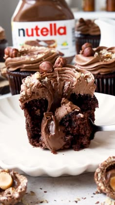 chocolate cupcakes with nutella frosting on a plate