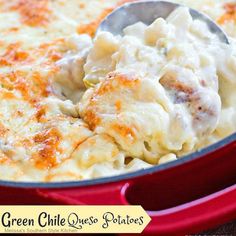 a red casserole dish with chicken and cheese