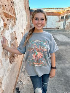 A great piece for any western wardrobe - the Yee Haw Botanical Cowgirl Graphic T-Shirt. This shirt is constructed with premium cotton for a soft, comfortable fit, and is designed with a boyfriend silhouette and rolled cuffs for a stylish finish. Snow-dyed for a unique look, this t-shirt is sure to be a head turner! Cowgirl Graphic, Western Wardrobe, Yee Haw, A Boyfriend, Graphic T Shirt, Comfort Fit, Graphic Tshirt, Dye, Wardrobe