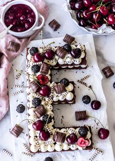 the letter e is made out of chocolate, cherries and marshmallows