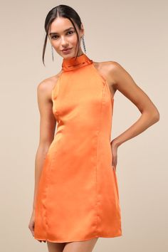 The Lulus Infinite Admiration Orange Satin Halter Mini Dress is the sophisticated party dress that everyone will love! Sleek woven satin shapes this lovely dress that has a princess-seamed bodice and a high halter neckline that ties above a back keyhole cutout. A figure-skimming silhouette falls to a flirty mini hem. Hidden back zipper. Fit: This garment fits true to size. Length: Mid-thigh. Size medium measures 32.5" from top to bottom. Bust: Great for any cup size. Waist: Fitted - very fitted Short Orange Dress, Satin Halter Dress, Orange Satin, Royal Blue Dresses, Halter Mini Dress, Halter Neckline, Orange Dress, Lovely Dresses, White Mini Dress