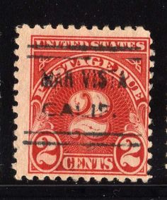 an old red and black stamp with the image of a bird on it