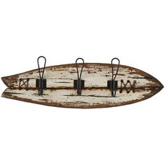 an old wooden surfboard with metal hooks