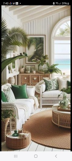 a living room filled with furniture and plants