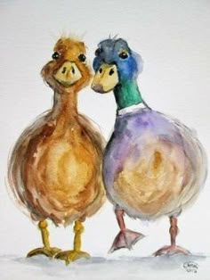 two ducks standing next to each other on a white surface with watercolor paint over it