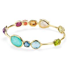 Color is the defining feature of this 18K gold bangle, each stone is deeply hued and hand-faceted to intensify its richness. The prong and bezel-set gems adorning its surface include dark amethyst, rock crystal, mother-of-pearl, lapis, peridot, Swiss blue topaz, and a triplet of mother-of-pearl layered above and below amethyst. Wear it to enhance the vibrancy of any bracelet stack. • 18K Gold • Gemstones: Dark Amethyst, Rock Crystal, Mother-of-Pearl, Lapis, Peridot, Swiss Blue Topaz, Clear Quart Ippolita Jewelry, Amethyst Rock, 18k Gold Bangle, Dark Amethyst, Earring Minimalist, Rainbow Gemstones, Bangles Jewelry Designs, Rock Candy, Jewelry Lookbook