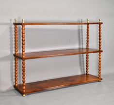 a wooden shelf with three shelves on each side