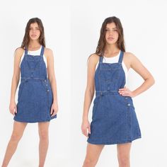 "90s 1990s LEE Dark Blue Denim Cotton Overall Pinafore Skort Short Wrap Skirt Mini Dress | Womens Ladies Girls Sleeveless Festival - Size M For 10% off your first purchase visit - www.marlowvintage.com Soft, light-weight chambray cotton/denim Overalls / pinafore style Skort - shorts underneath, with a wrap skirt across the front Curvy fit   EXCELLENT vintage condition - 1 small area of wear on the back Measurements Size: M Waist: ~ 30\" Hips: ~ 44\" Length: ~ 96cm (2x button loops at the back, to adjust the length of straps) Fabric: Chambray Cotton / Denim Brand: LEE   Model Measurements Leah is 183cm | Bust: 35\"/89cm | Waist: 28\" | Hips: 37\"/94cm   || All vintage items are preloved & may show signs of wear. || Colours may vary from screen to screen." Sleeveless Denim Blue Shortalls, Blue Denim Sleeveless Shortalls, Casual Sleeveless Denim Pinafore Dress, Casual Mini Pinafore Dress With Pockets, Casual Blue Sleeveless Pinafore Dress, Blue Sleeveless Casual Pinafore Dress, Wrap Skirt Mini, Short Wrap Skirt, Skirt Mini