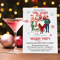 a holiday party with a pink martini and christmas decorations in front of a festive tree