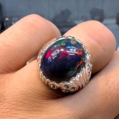 Description: Real Black Opal Stone Ring For Men, Black Opal Men's Ring,  Sterling Silver 925, AAA Quality Opal Ring, Handmade Fire Opal Mens Ring,  Stone Weight: 5 carats Stone Dimension: 13.0x9.7 mm Stone Shape: Oval Stone Type: Natural Untreated Unheated Stone Origin: Ethiopian Ring Sizes: All US, UK, EU, International Sizes Available Carrier: USPS, UPS, FedEx Stone Ring For Men, Stone Rings For Men, Opal Stone Ring, Black Opal Stone, Uv Black Light, Fire Opal Ring, Ring Stone, Ring For Men, Mens Ring