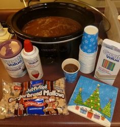 the ingredients to make this holiday dessert are displayed in front of an crock pot