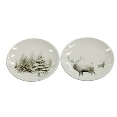 two plates with deer and pine trees on them