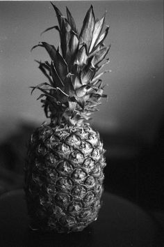 a black and white photo of a pineapple