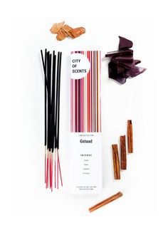 an assortment of incenses and sticks on a white background