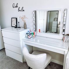 a white desk with a chair and mirror