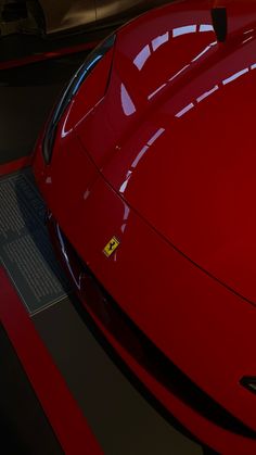 a red sports car parked in a garage