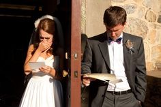 a bride and groom standing in front of a door