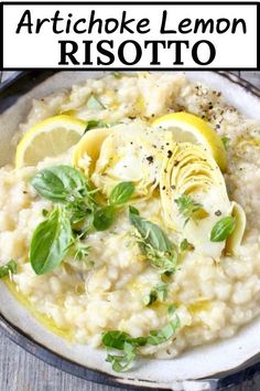 artichoke lemon risotto on a white plate with basil and lemon wedges