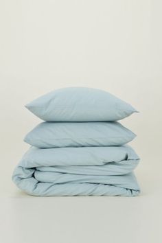 three pillows stacked on top of each other