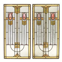 two stained glass panels with flowers and leaves on the bottom one is gold, the other is white