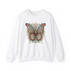 Boho Butterfly Sweatshirt, Cottagecore Clothing, Butterfly Crewneck Sweatshirt, Vintage sweatshirt For butterfly Lover Ideal for any situation, a unisex heavy blend crewneck sweatshirt is pure comfort. These garments are made from polyester and cotton.  The collar is ribbed knit, so it retains its shape even after washing. There are no itchy side seams on these sweaters.  .: Made with a medium-heavy fabric blend of 50% cotton and 50% polyester (8.0 oz/yd² (271.25 g/m this sweatshirt feels cozy and is the perfect choice for those colder months. - The classic fit along with the crew neckline deliver a comfy wearing experience with a clean-cut style. Meanwhile, the double-needle stitching at the shoulder, armhole, neck, waistband, and cuff seams add top-tier durability.   Say goodbye to itchi White Long Sleeve Top With Butterfly Print, White Butterfly Print Top For Fall, Aesthetics Picture, Majestic Butterfly, Butterfly Crewneck, Butterfly Sweatshirt, Boho Butterfly, Sweatshirt Vintage, Embroidery Techniques