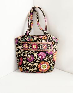 Vera Bradley colorful floral quilted tote bag. There are 2 slip pockets inside. In excellent used condition. Approximate measurements: 10.5" W measured along the bottom (13.5" W at the opening) 11.5" H 3.5" D at the base 11" handle drop DELIVERY OPTIONS: I ship by US Postal Service with tracking; I will email you the tracking number after shipping.  RETURNS: Should you change your mind about your purchase indiecreativ will gladly accept return of the item in its original condition for a refund (of purchase price minus shipping fee). It is always best to ask any questions you have before making a purchase to avoid the need to return, especially with regard to vintage items. To re-enter this shop: http://www.etsy.com/shop/indiecreativ Multicolor Floral Print Bags With Double Handle, Multicolor Floral Print Bag With Double Handle, Multicolor Floral Print Rectangular Shoulder Bag, Quilted Multicolor Shoulder Bag For Travel, Multicolor Quilted Bags, Everyday Multicolor Quilted Bags, Multicolor Quilted Bag For Daily Use, Multicolor Quilted Tote Bag, Multicolor Quilted Shoulder Bag For Daily Use