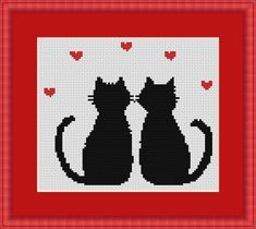 two black cats sitting next to each other in front of a red frame with hearts