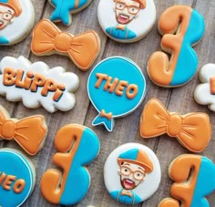 decorated cookies with the words blipp and an image of a man in bow tie