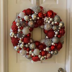 Beautiful festive bulb wreath.  One of a kind ready to display. Reds, white, and silver.  Sparkly and shiny!  I love this one! Red And Silver Bauble Wreath, Christmas Ball Wreath, Ornament Wreath Diy, Bulb Wreath, Ball Wreath, Holiday Deco, Christmas Table Centerpieces, Valentines Crafts, Diy Wreaths