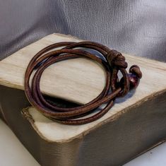 This handcrafted leather wrap bracelet offers a laid-back surfer vibe with a touch of boho style. Made from durable 3mm natural leather, it wraps 3-4 times around your wrist, with an adjustable knot-and-loop clasp. Available in multiple colors and perfect for casual, rustic looks. Embrace natural elegance today!Material: 3mm natural distressed leatherWidth: about 1/2 inch (10-12cm)Color: black, brown, navy blue or naturalLength: fit 6-7.5 inch, triple wrapClosure: knot and loop clasp.3-4 times w Brown Adjustable Wrap Bracelet For Everyday, Rugged Brown Leather Bracelet With Waxed Finish, Casual Brown Leather Bracelet With Sliding Knot, Rustic Brown Leather Bracelet For Everyday, Adjustable Rustic Brown Wrap Bracelet, Rustic Brown Adjustable Wrap Bracelet, Brown Waxed Finish Bracelet, Casual Brown Leather Bracelet For Everyday Use, Casual Brown Leather Bracelet For Everyday