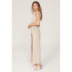 Beige linen blend (55% Linen, 45% Rayon). Jumpsuit. Sleeveless. V-neck. Back zipper closure. 58" from shoulder to hemline. 29" inseam. 19" rise. 25" leg opening. Imported. Sleeveless Linen Jumpsuits For Day Out, Sleeveless Linen Jumpsuits And Rompers For Day Out, Elegant Sleeveless Linen Jumpsuit, Notes Style, Rosetta Getty, Linen Jumpsuit, Rent The Runway, Closet Designs, Linen Blend