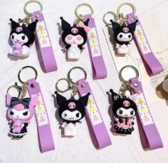 six key chains with cartoon characters on them