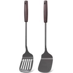 two forks and a spatula on a white background