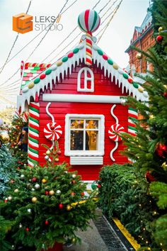 a red house decorated with candy canes and lights