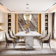 an elegant dining room with marble table and chairs