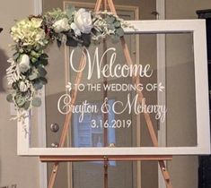 an easel with a sign that says welcome to the wedding of creation and memory