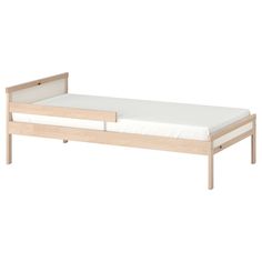 the bed frame is made from wood and has two drawers on one side, with no mattress