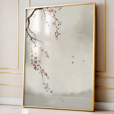 a framed photo with pink flowers on it in front of a white wall and floor