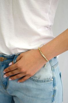 "Bodhi in Sanskrit and Pali means \"awakening\", \"enlightenment\", which puts an end to the cycle of Samsara ( transmigration ) and leads to Nirvana, or Spiritual libration. This one row gold nugget woven bracelet with beige cotton cords reminds the wearer of their spiritual path and joy of awakening, a great wishful gift for love and peace. Bracelet length is adjustable." Adjustable Beaded Bracelets For Meditation, Spiritual Beaded Bracelets With Adjustable Length, Fusion Style Adjustable Bracelets For Meditation, Adjustable Fusion Bracelets For Meditation, Adjustable Fusion Style Bracelets For Meditation, Spiritual Adjustable Bracelets For Everyday, Spiritual Jubilee Beaded Bracelets, Gold Spiritual Friendship Bracelets, Adjustable Gold Beaded Fusion Bracelets