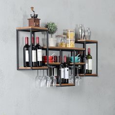 a wine rack filled with bottles and glasses