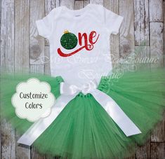 "This adorable Ornament Birthday Outfit will add the perfect touch to your little ones Christmas themed first birthday! Ornament Designs are made of commercial grade vinyl that is heat pressed to ensure the lifespan of your shirt. This listing also includes the option of adding a tutu & your little loves name to the \"BIRTHDAY One Shirt\" if selected from the options menu. ~ CURRENT Processing time is 3-5 BUSINESS DAYS ~ ~ If you need your order by CERTAIN DATE please CONTACT ME ~ ★★ ORDERING INSTRUCTIONS ★★ ::DESIGN COLORS: Please use the \"VINYL\" color charts to select the color(s) you would like the design to be. If no colors are noted on your order then you will be sent what is in the first picture of this listing. ::TUTU COLORS: Choose up to 3 colors from the \"TULLE\" color chart an Christmas Themed First Birthday, Birthday Outfit Winter, Halfway To One, Half Birthday Shirt, Tutu Size Chart, Winter Birthday Outfit, Winter Wonderland Birthday, Ornament Designs, Birthday One